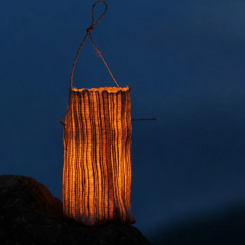 Handwoven natural fiber lantern with warm white flickering light and handle for display 14