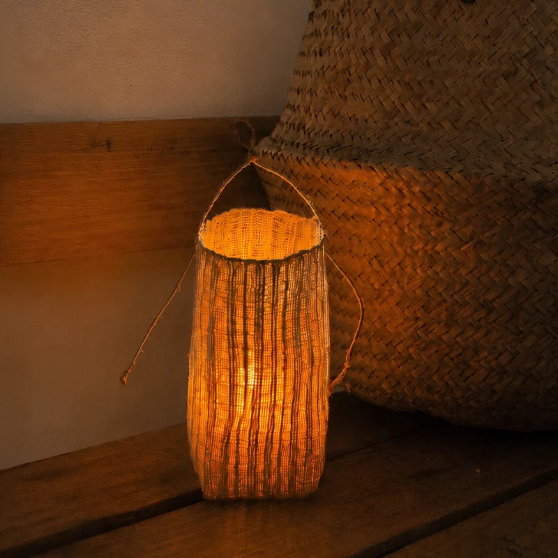 Handwoven natural fiber lantern with warm white flickering light and handle for display 2