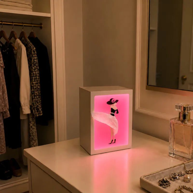 Interactive artistic tissue box with touch-sensitive ambient glow lighting and fashion-inspired illustration design 6