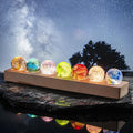 Set of seven luminous crystal galaxy orbs on wooden base with USB-powered LED lighting 3