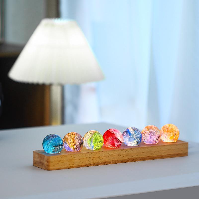 Set of seven luminous crystal galaxy orbs on wooden base with USB-powered LED lighting 9