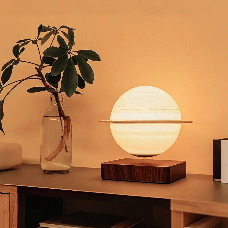 Magnetic levitating planet lamp hovering and rotating above its base with soft ambient glow 10