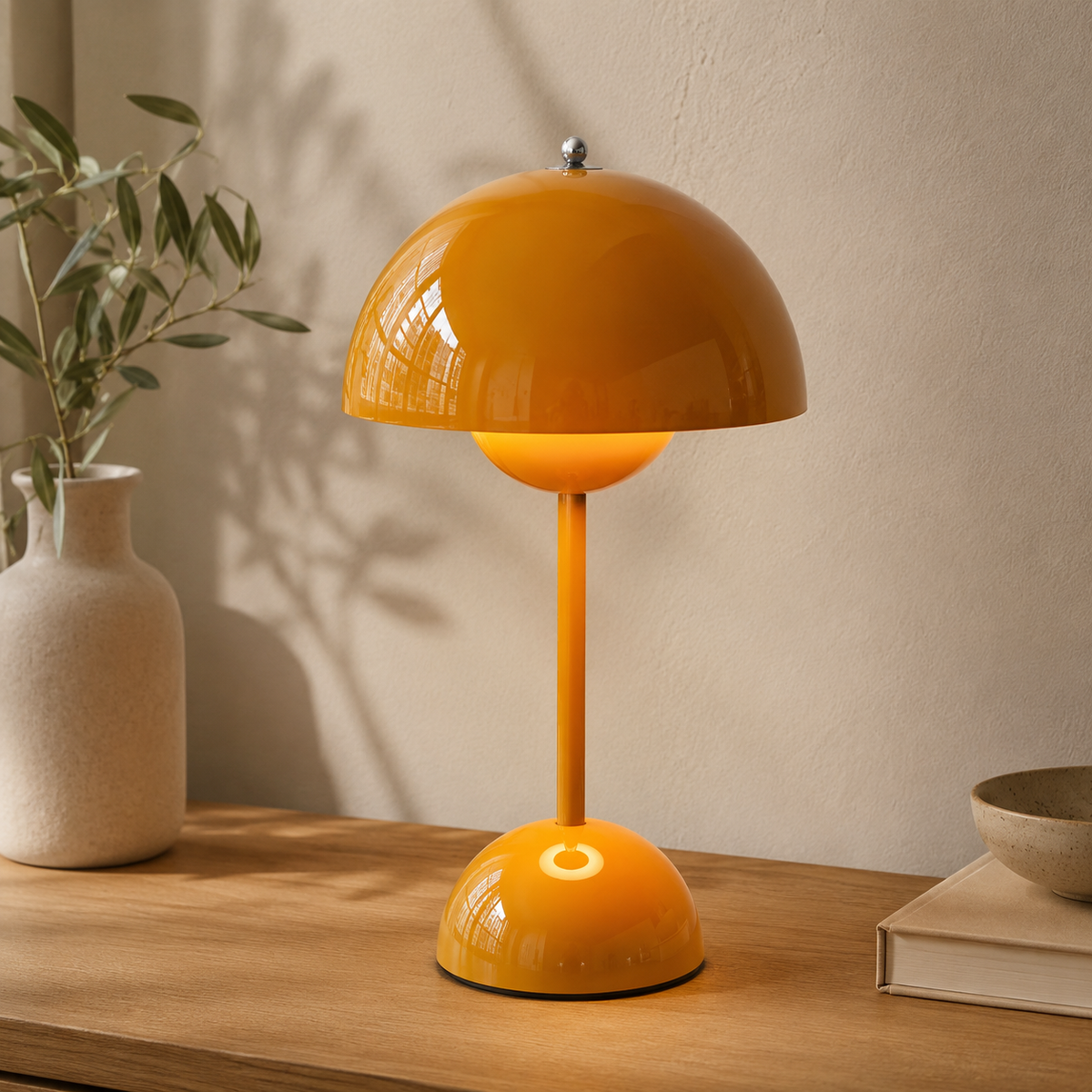 Stylish cordless table lamp with a rounded bud-like dome and touch control.