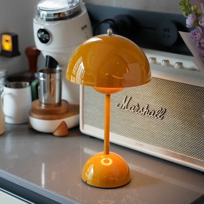 Stylish cordless table lamp with a rounded bud-like dome and touch control. 7