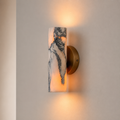 Elegant natural marble wall sconce with Baccarat crystal.