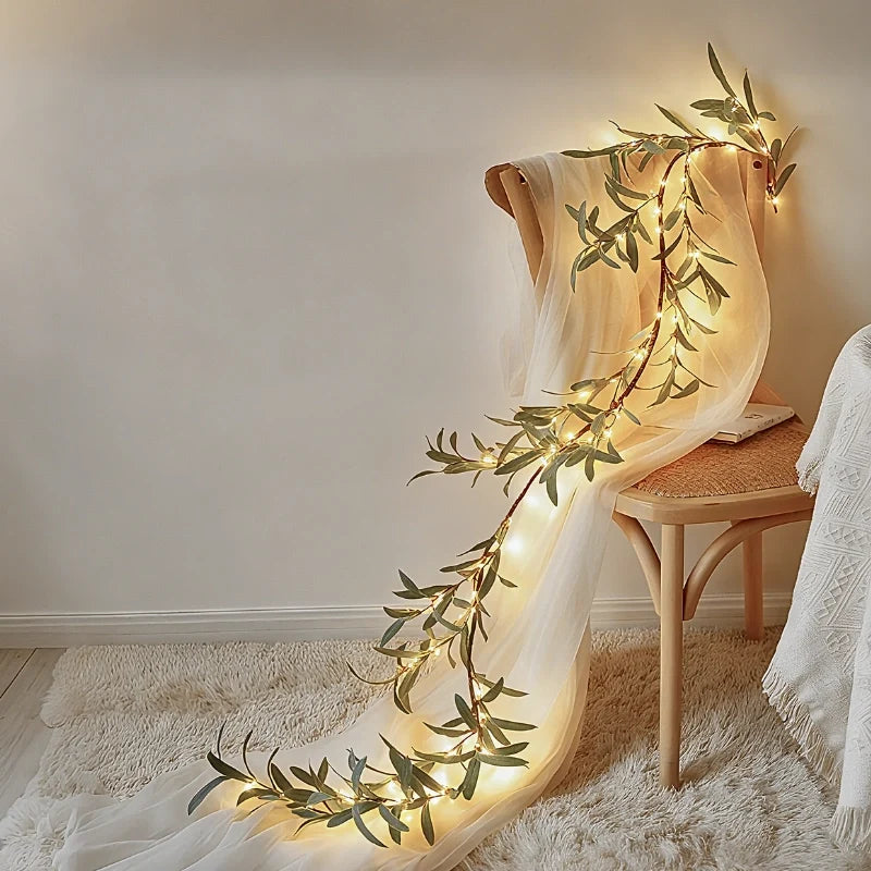 Botanical garland light string with warm white glow and natural foliage design 19