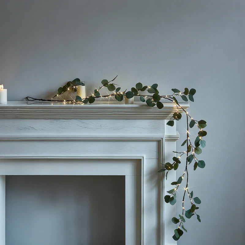 Botanical garland light string with warm white glow and natural foliage design 22