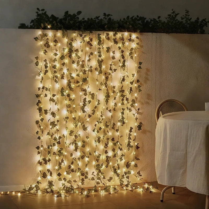 Botanical garland light string with warm white glow and natural foliage design 25