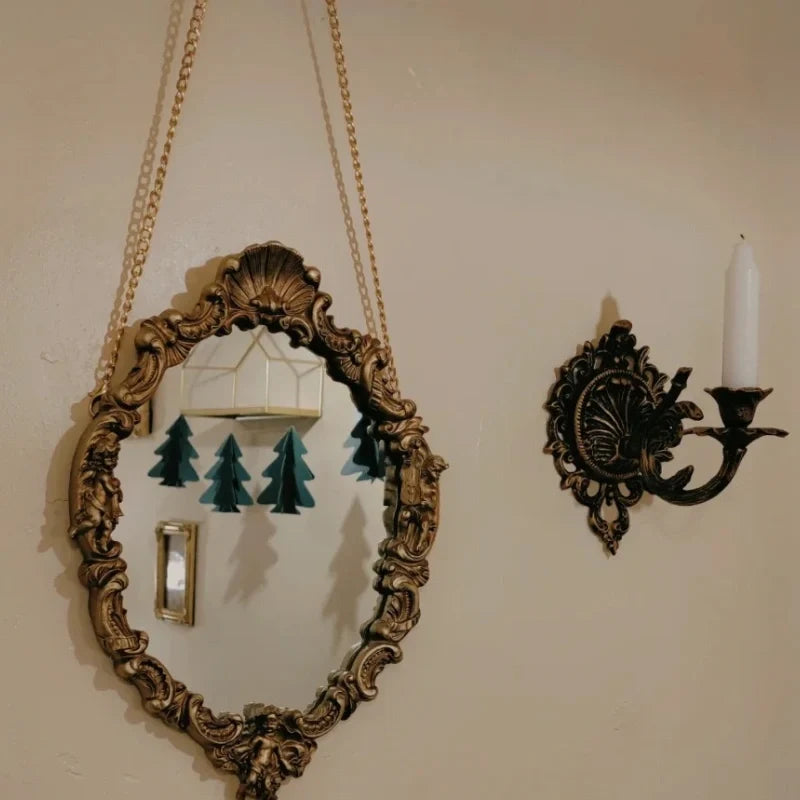 Ornate cast iron wall-mounted candle sconce with vintage scrollwork design 10