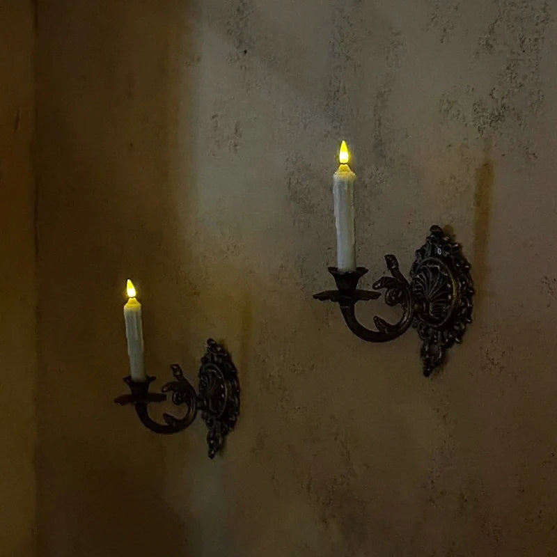 Ornate cast iron wall-mounted candle sconce with vintage scrollwork design 12