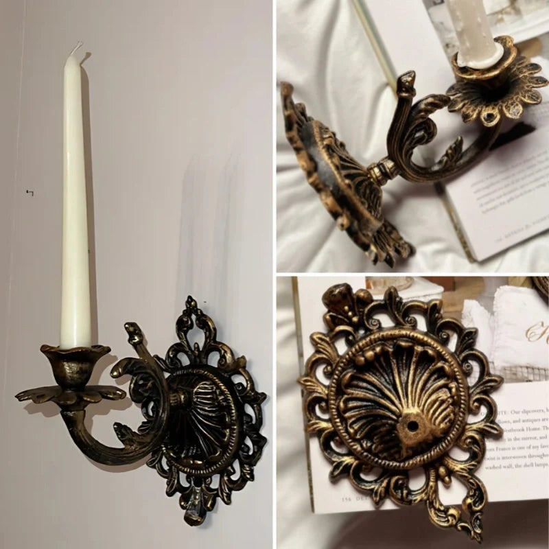 Ornate cast iron wall-mounted candle sconce with vintage scrollwork design 13