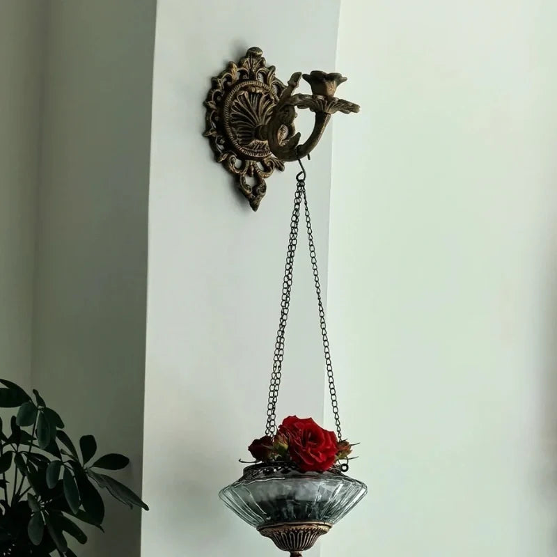Ornate cast iron wall-mounted candle sconce with vintage scrollwork design 14