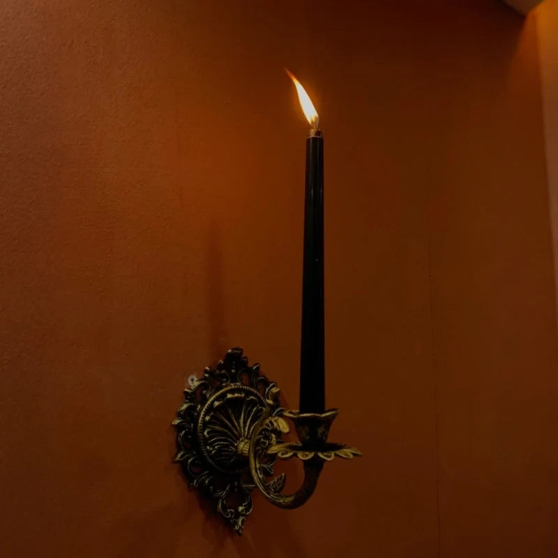 Ornate cast iron wall-mounted candle sconce with vintage scrollwork design 3