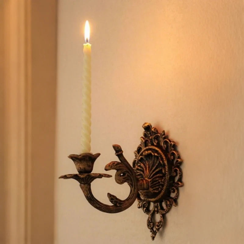 Ornate cast iron wall-mounted candle sconce with vintage scrollwork design 4
