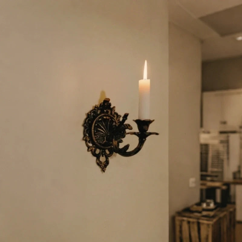 Ornate cast iron wall-mounted candle sconce with vintage scrollwork design 5
