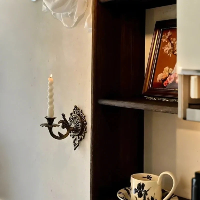 Ornate cast iron wall-mounted candle sconce with vintage scrollwork design 6