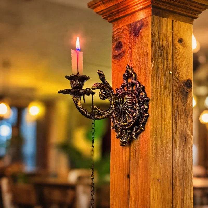 Ornate cast iron wall-mounted candle sconce with vintage scrollwork design 8