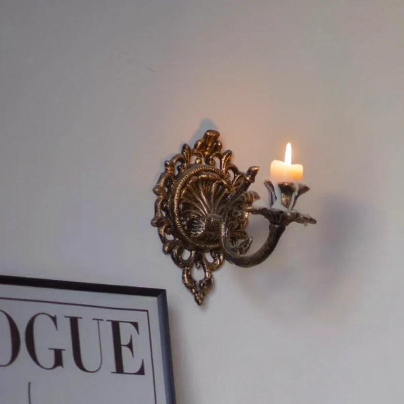 Ornate cast iron wall-mounted candle sconce with vintage scrollwork design 9