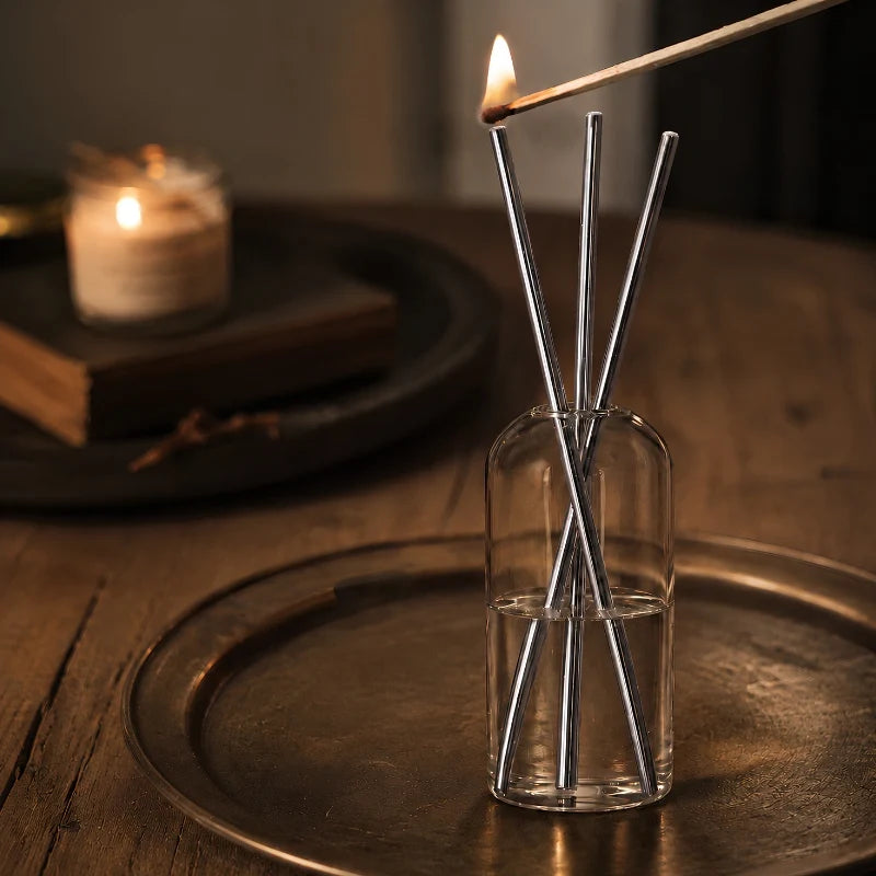 Refillable Everlasting Flame oil candle with clear glass vessel and stainless steel details 6