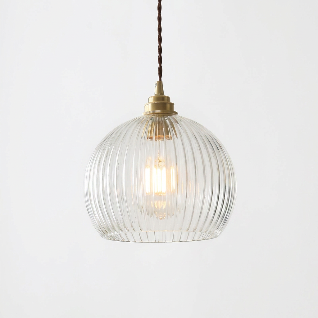 Elegant ribbed glass globe pendant lamp with brass canopy and twisted cable.