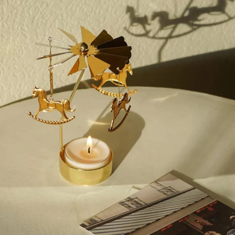 Rotating golden candle carousel with spinning ornaments creating warm reflections 8