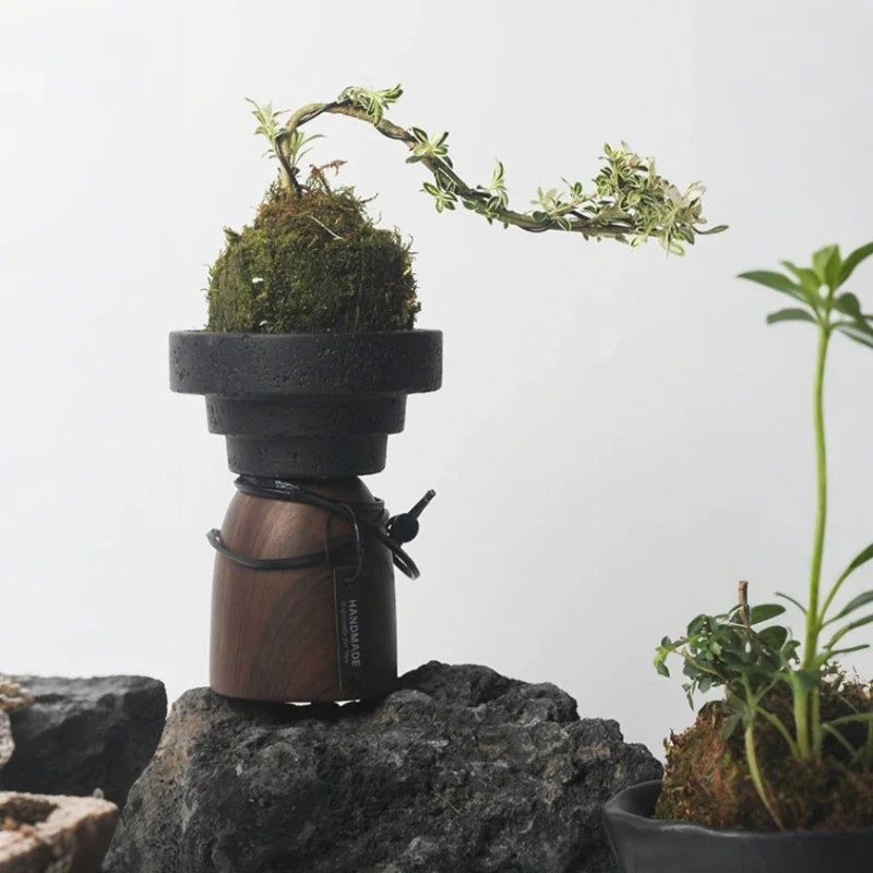 Sculptural cement and wood candle holder with textured volcanic-inspired design 12
