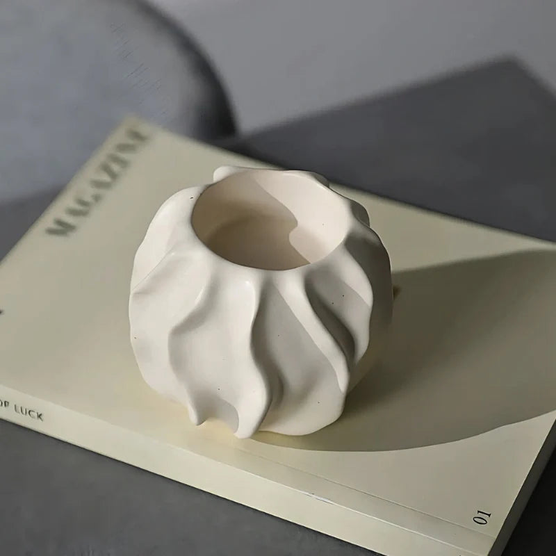 Sculptural ceramic candle holder with rippled matte finish design in neutral tone 13