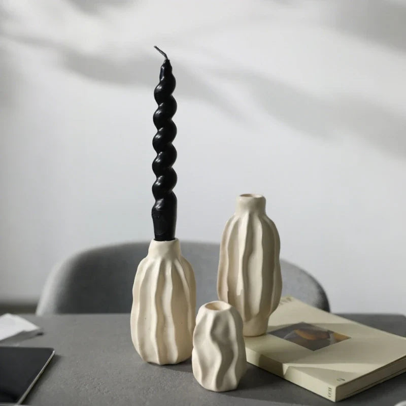 Sculptural ceramic candle holder with rippled matte finish design in neutral tone 2
