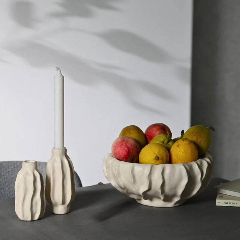 Sculptural ceramic candle holder with rippled matte finish design in neutral tone 3