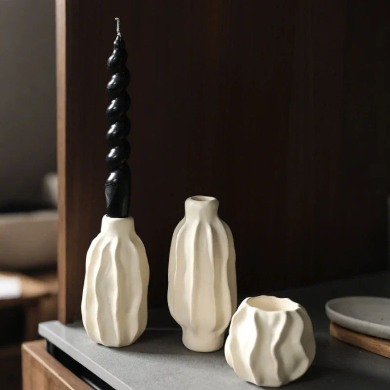 Sculptural ceramic candle holder with rippled matte finish design in neutral tone 4