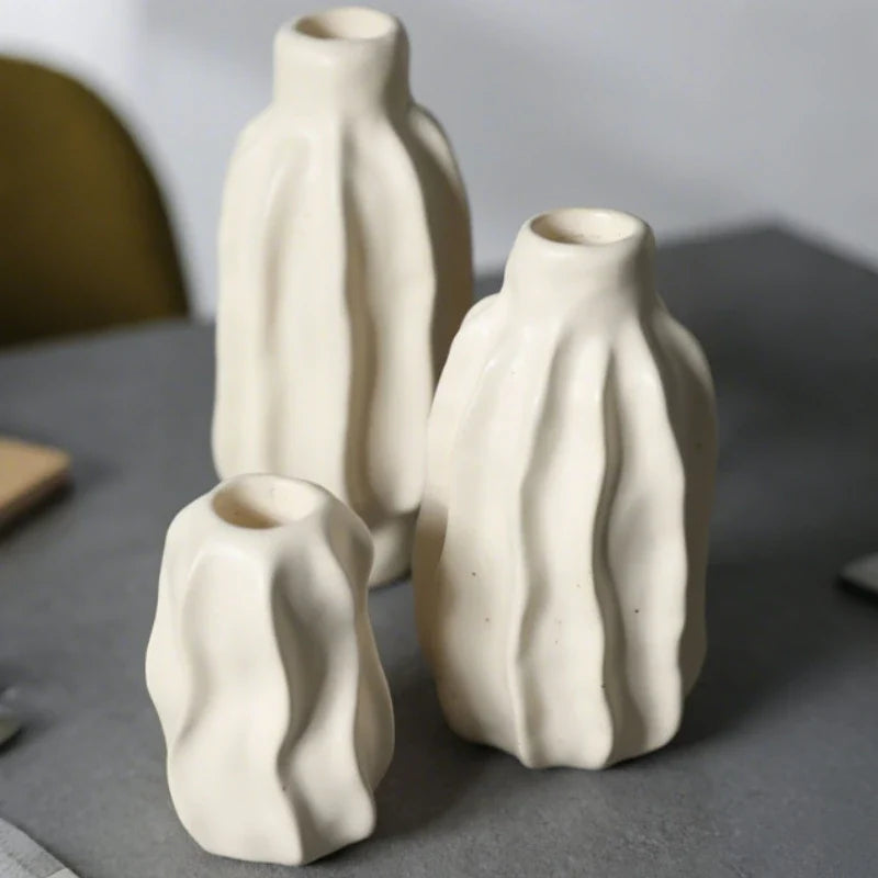Sculptural ceramic candle holder with rippled matte finish design in neutral tone 7