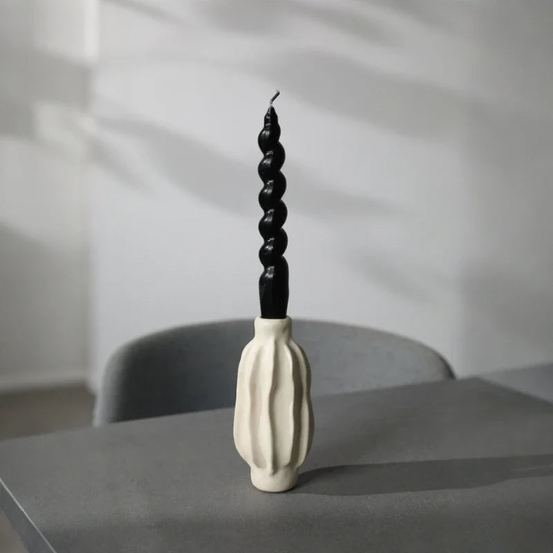 Sculptural ceramic candle holder with rippled matte finish design in neutral tone 9