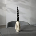 Sculptural ceramic candle holder with rippled matte finish design in neutral tone 9