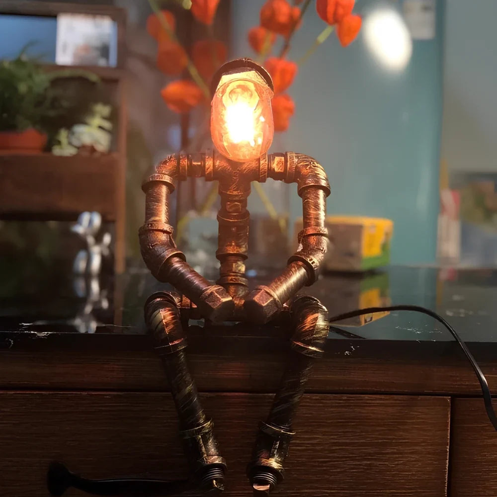 Sculptural Steampunk Sentinel Light crafted from iron pipes with exposed vintage bulb 5