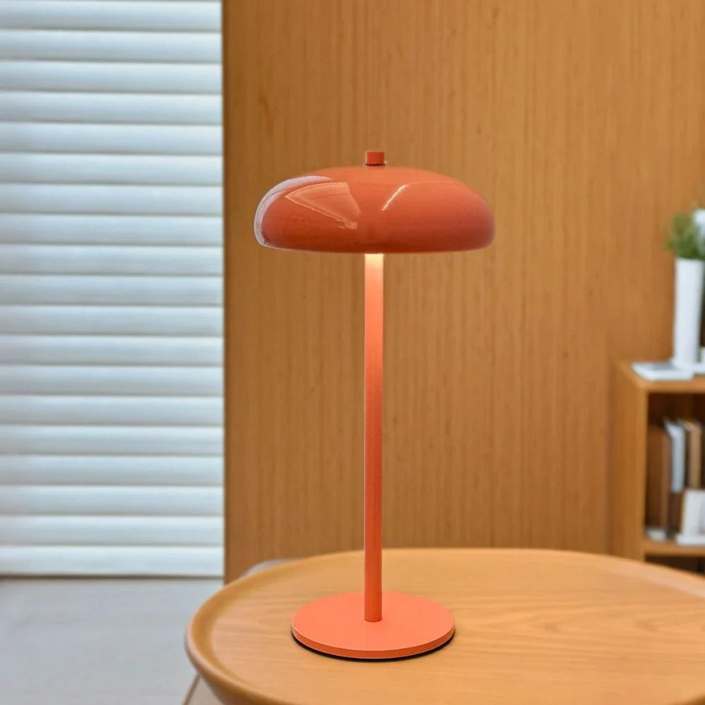 Sleek rechargeable retro table lamp with rounded top and touch control, emitting warm white light 11