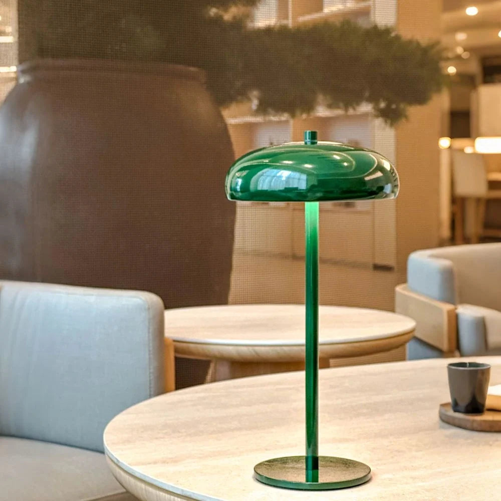Sleek rechargeable retro table lamp with rounded top and touch control, emitting warm white light 9