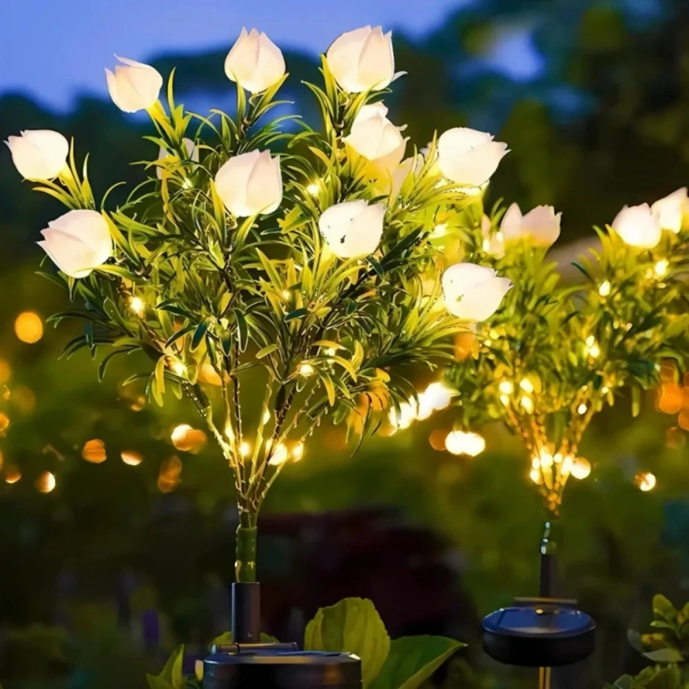 Solar flower lights with realistic blooms in warm and cool white colors for garden decoration