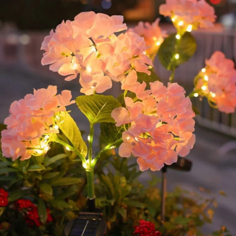 Solar flower lights with realistic blooms in warm and cool white colors for garden decoration 2