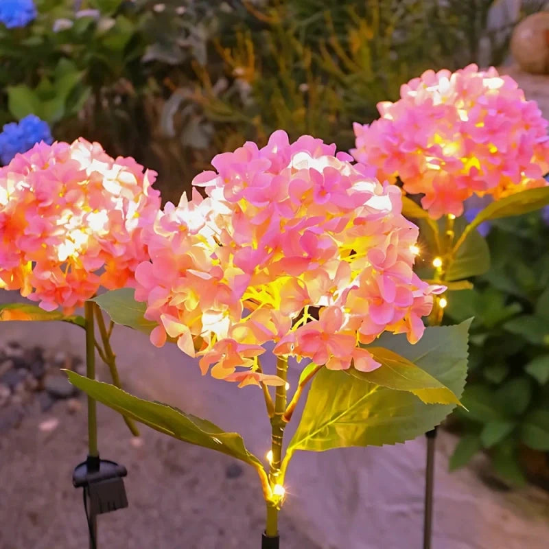 Solar flower lights with realistic blooms in warm and cool white colors for garden decoration 20