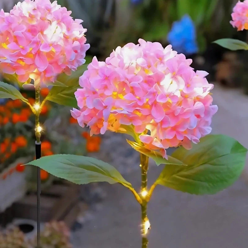 Solar flower lights with realistic blooms in warm and cool white colors for garden decoration 21