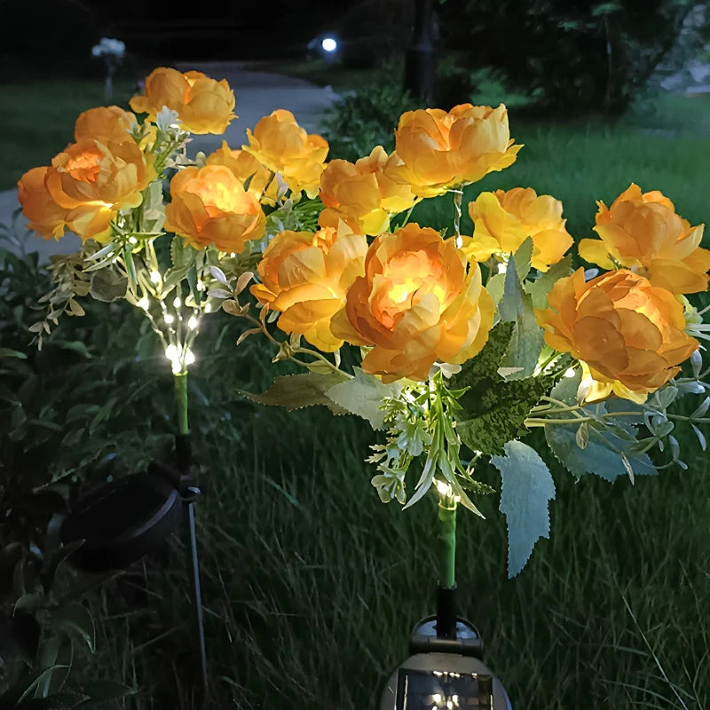 Solar flower lights with realistic blooms in warm and cool white colors for garden decoration 30