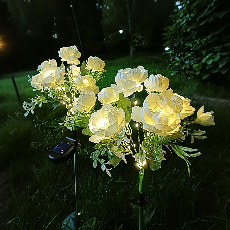 Solar flower lights with realistic blooms in warm and cool white colors for garden decoration 31