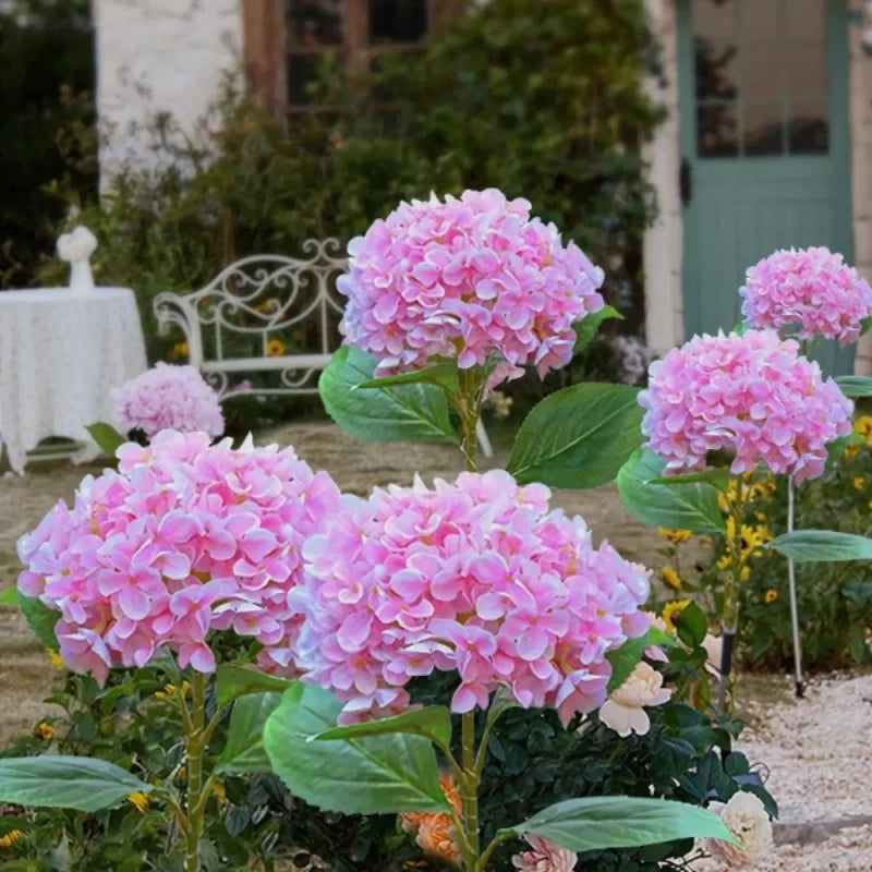 Solar flower lights with realistic blooms in warm and cool white colors for garden decoration 7