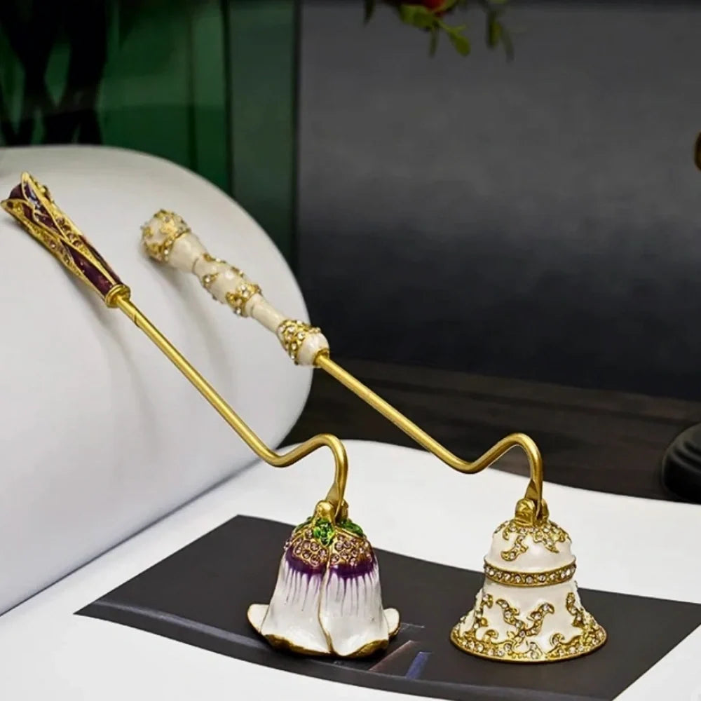 Vintage floral candle snuffer with porcelain-inspired detailing and gold-toned enamel accents