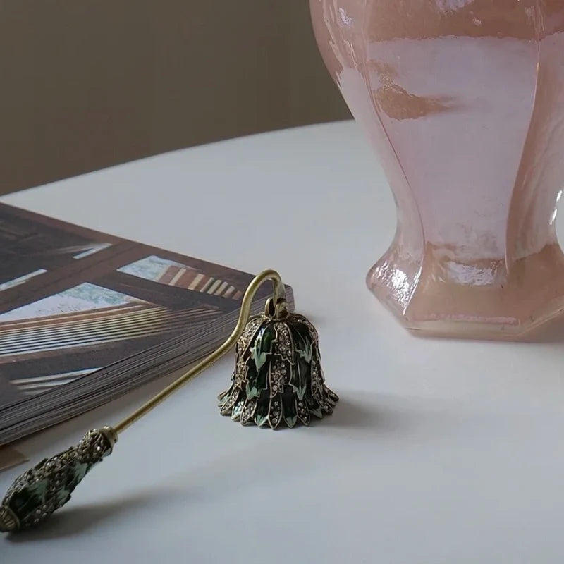 Vintage floral candle snuffer with porcelain-inspired detailing and gold-toned enamel accents 16