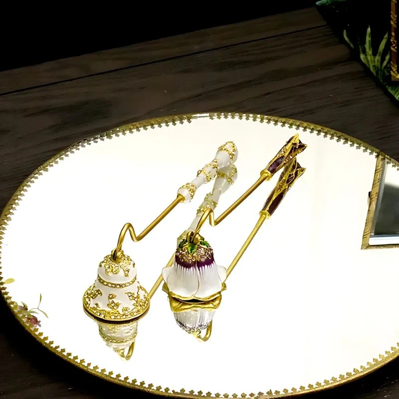Vintage floral candle snuffer with porcelain-inspired detailing and gold-toned enamel accents 18