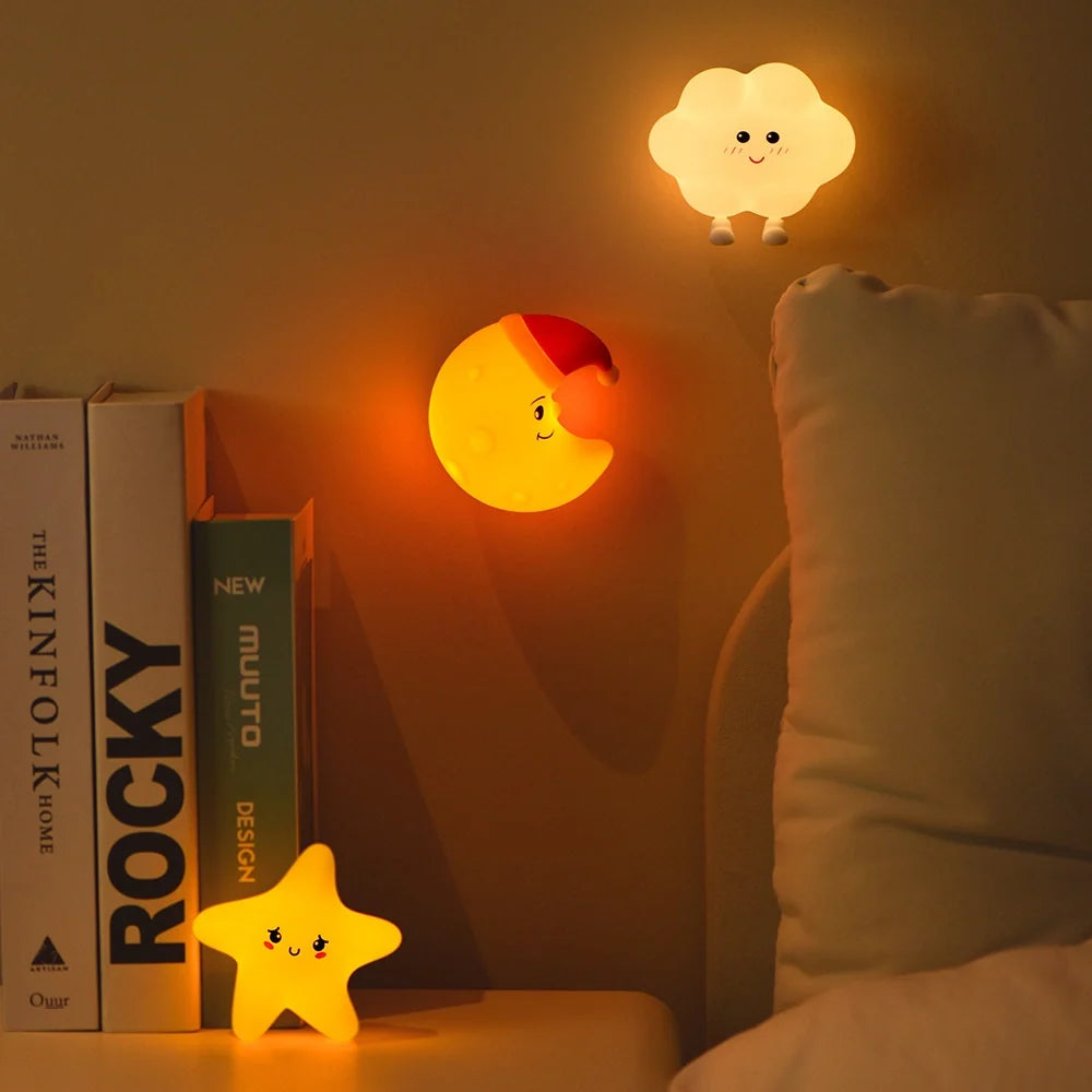 Whimsical DreamBuddies rechargeable night light in moon, star, and cloud shapes with warm white glow